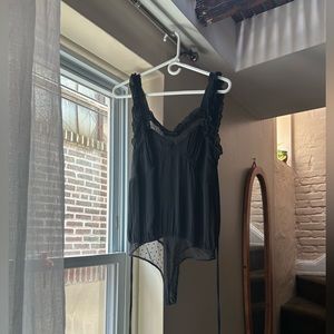 Sexy boho Free People body suit lingerie blouse with black polka dot lace.